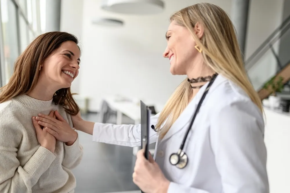 Female speaking to a doctor about what to expect from FemiLift