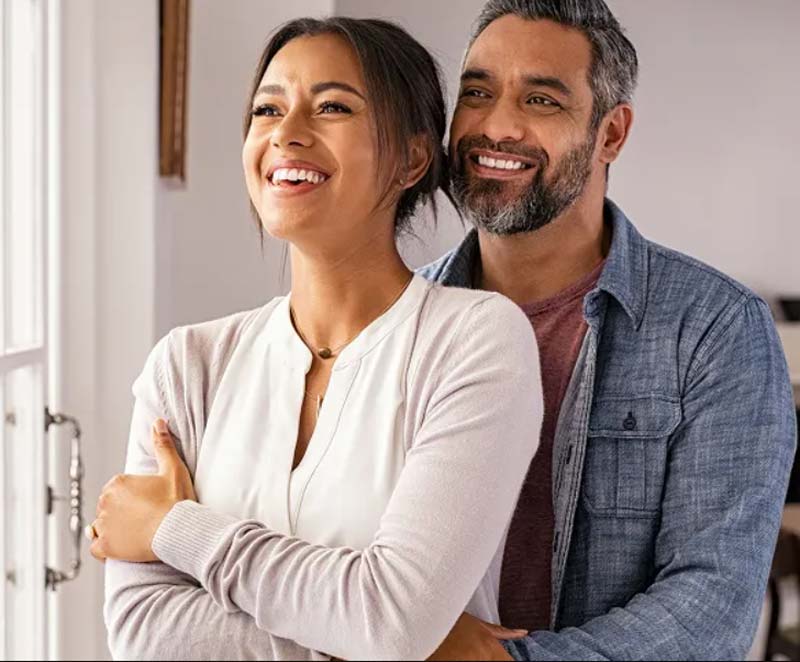 Couple Smiling Thinking About Getting a Hormone Specialist in Orange County, CA